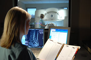 Headache & Pain Center medical staff using GE Open MRI equipment